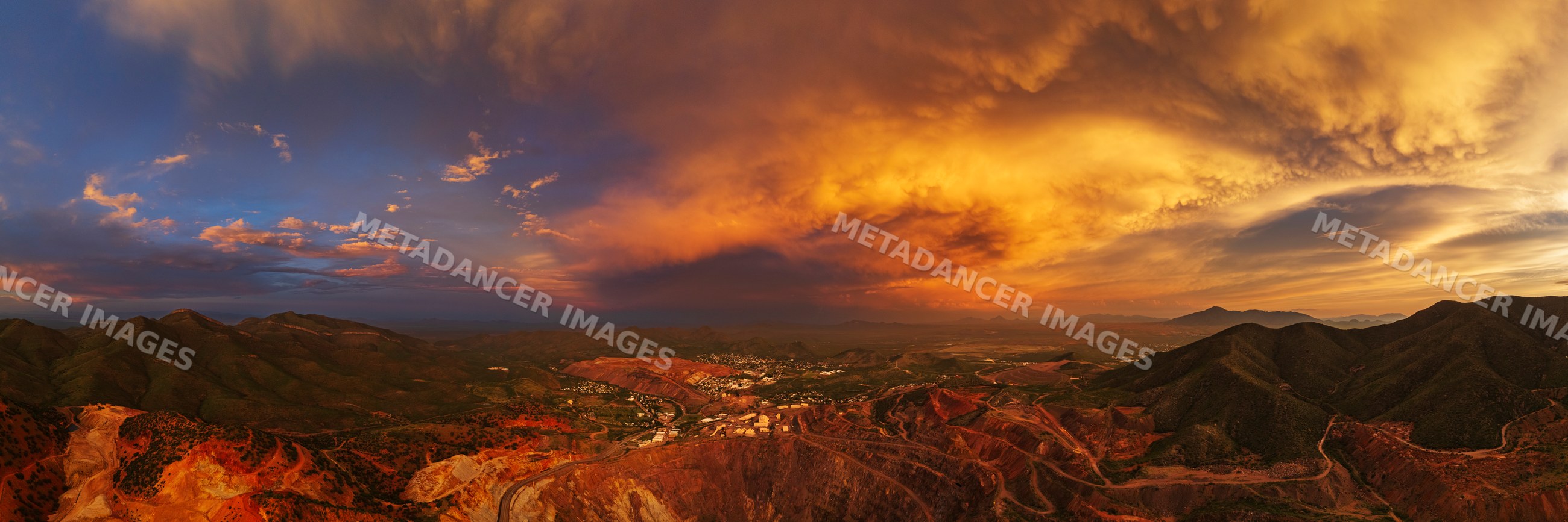 Aerial view of the Bisbee Copper Mine at Dusk with storm clouds