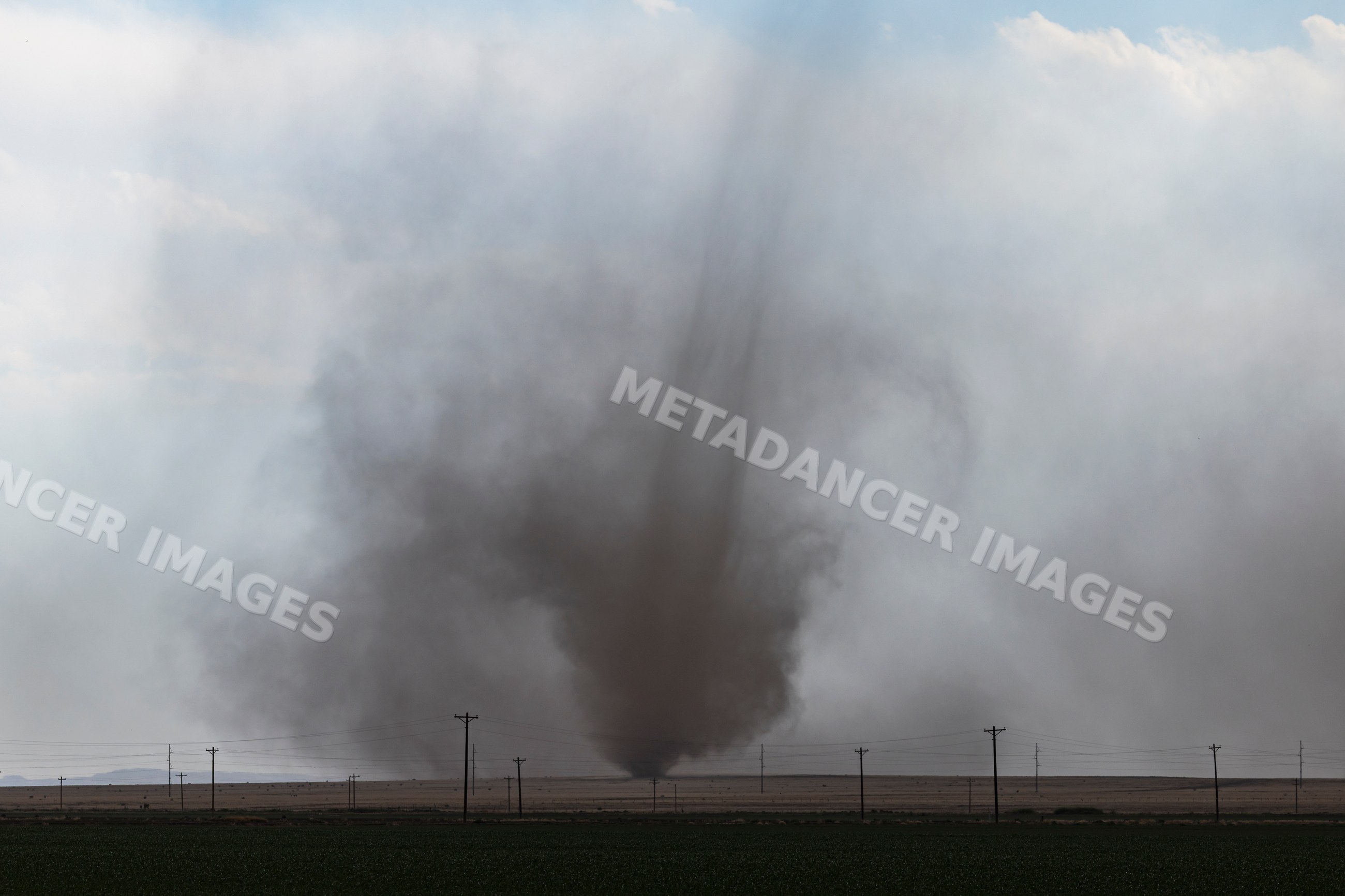 Landspout tornado forming near county road 2 in fowler, colorado