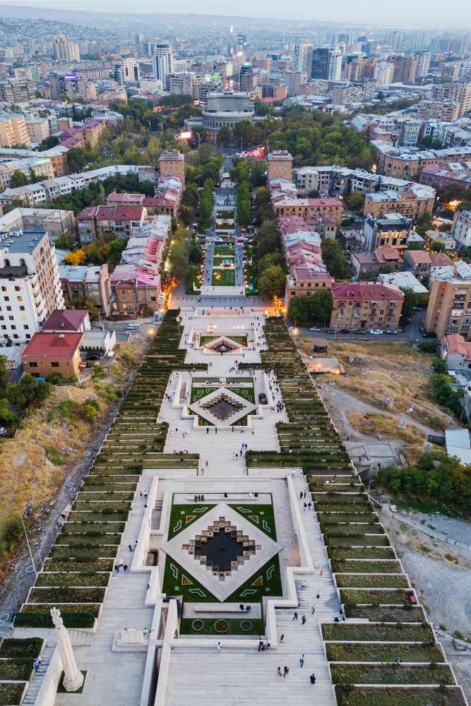 The cascade stairs and gardens in yerevan at dusk aerial view