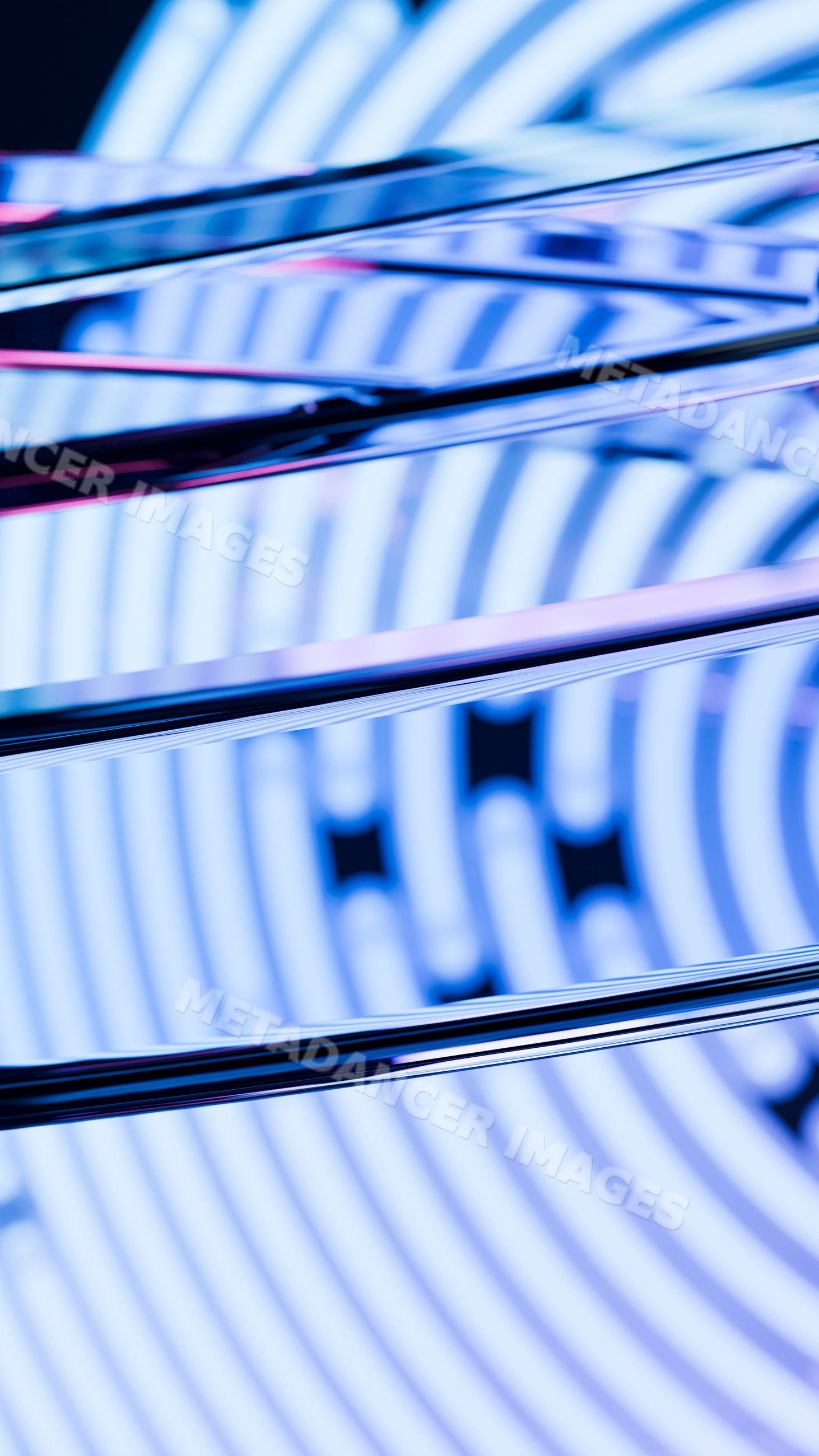 Close-up of reflective metal rods with blue circular pattern