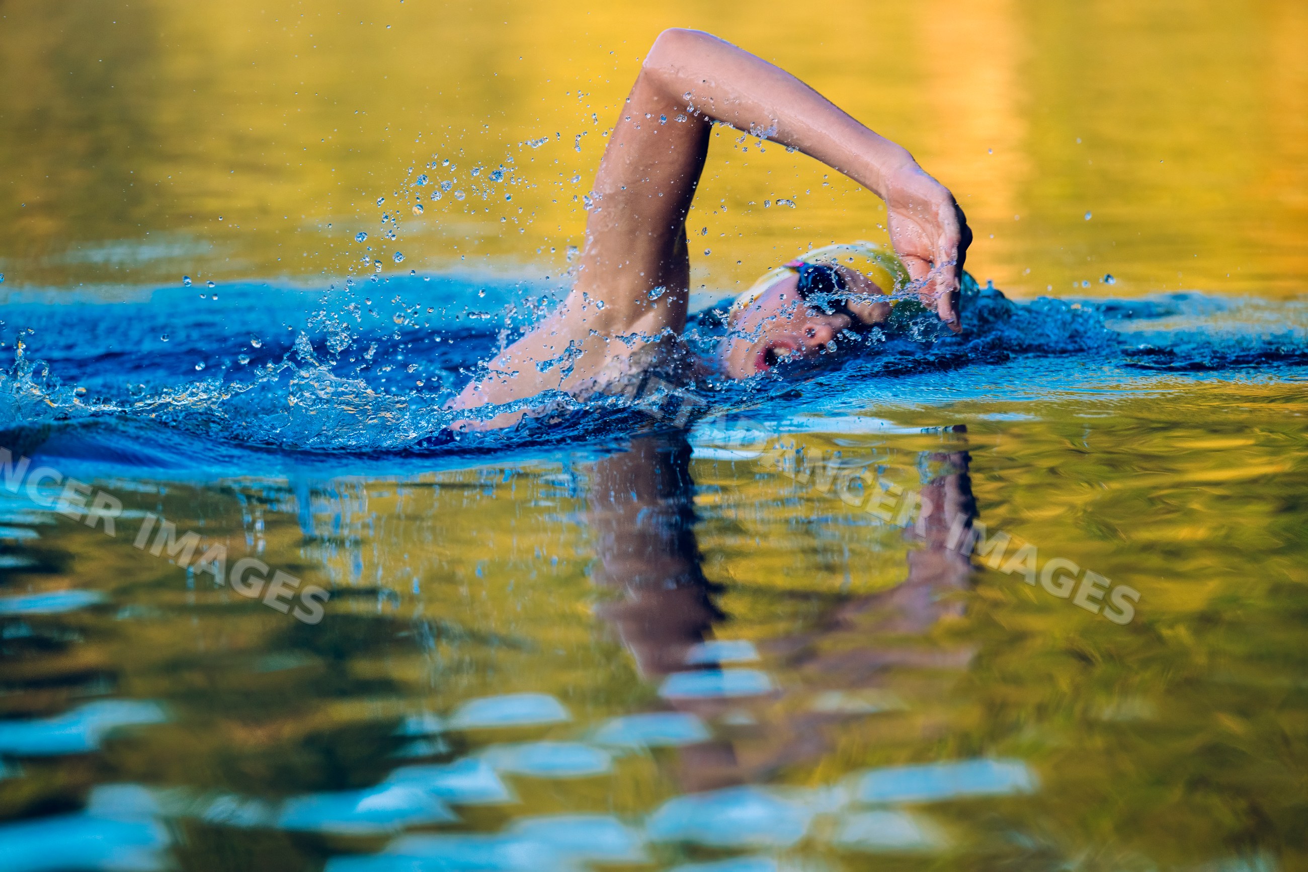 White swimmer performing open water freestyle stroke with splashing