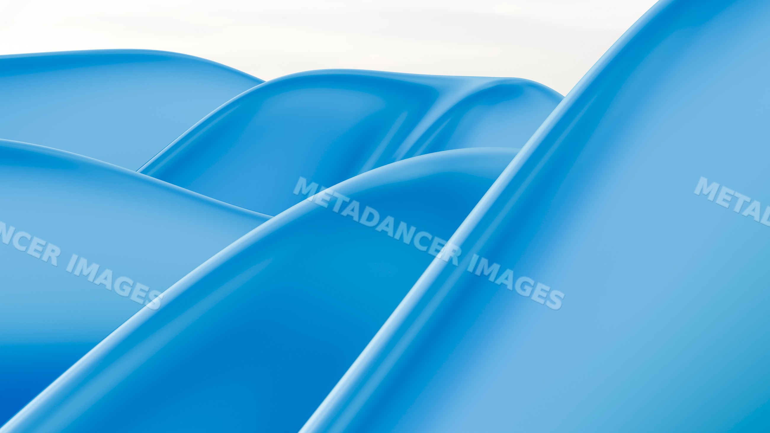 Curved blue plastic playground slides in outdoor setting
