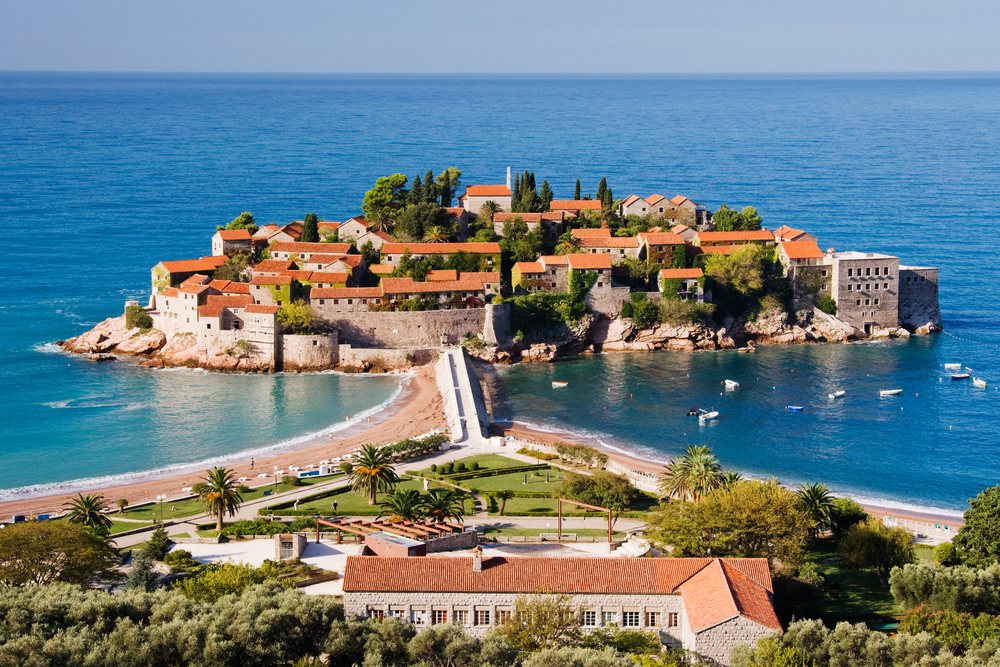 Sveti stefan island village with red tile roofs