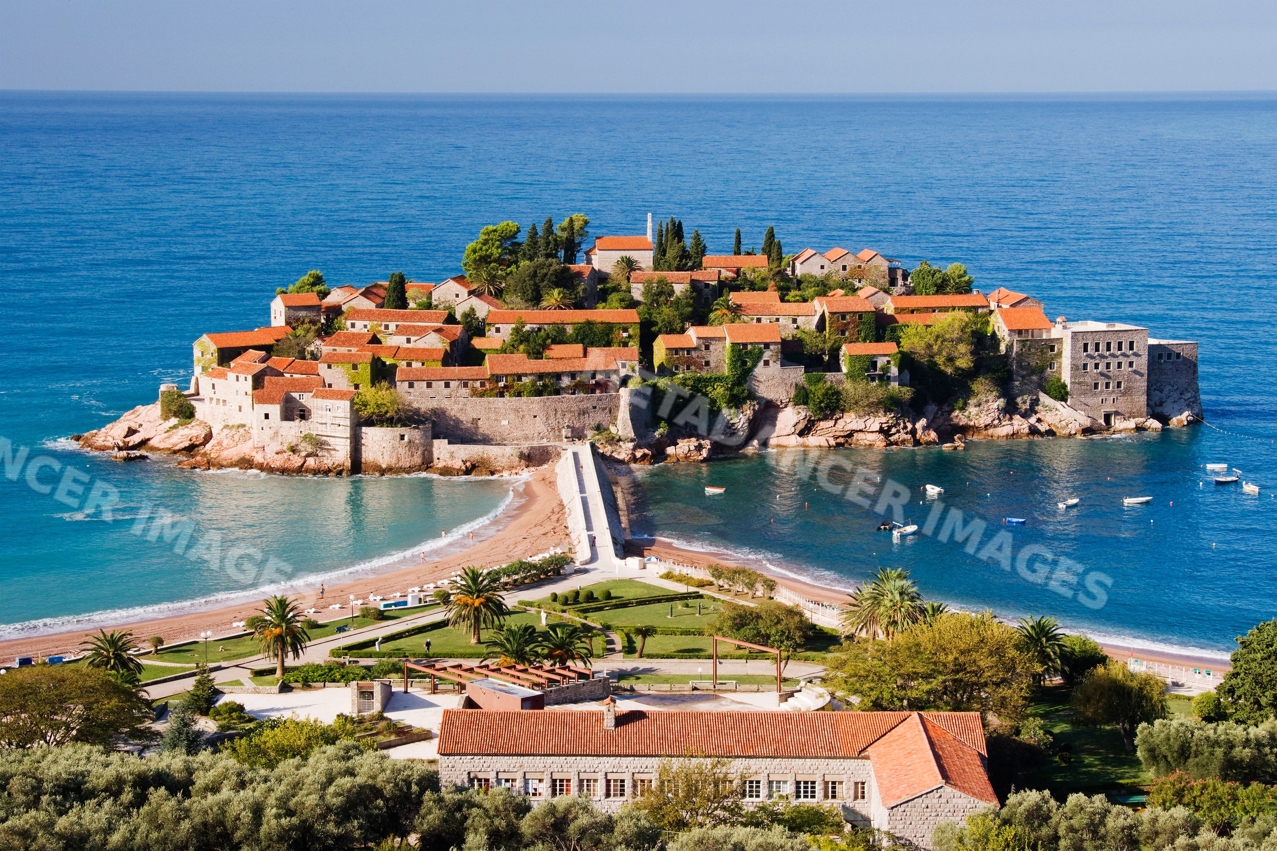 Sveti stefan island village with red tile roofs