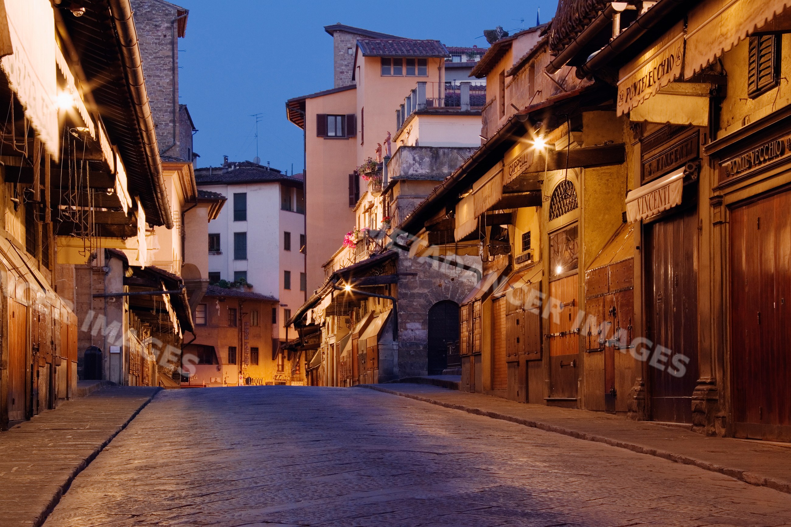 Evening view of ponte vecchio historic street, italy