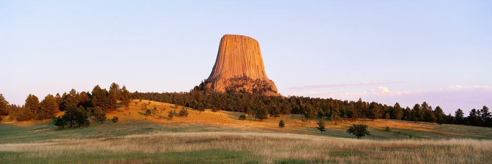 Devil's tower rock formation at sunset in wyoming USA