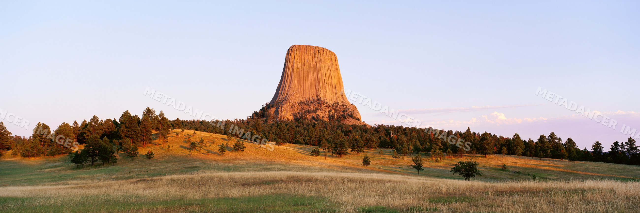 Devil's tower rock formation at sunset in wyoming USA