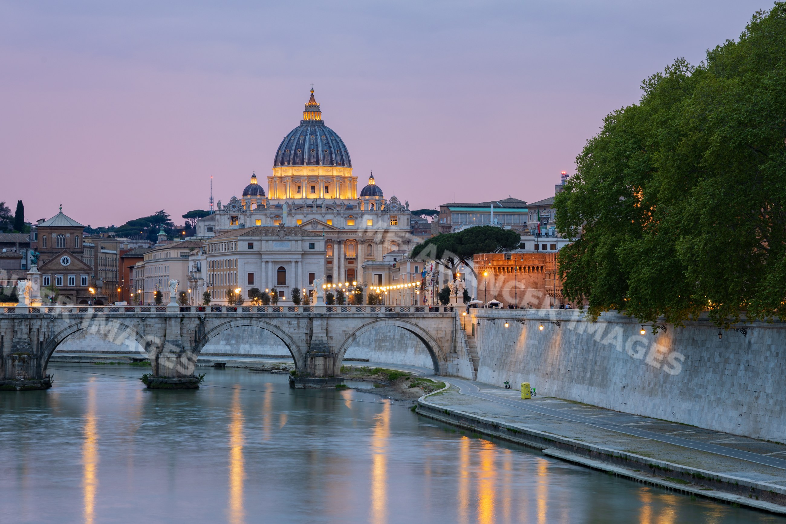 St peter's basilica at Dusk with river and bridge