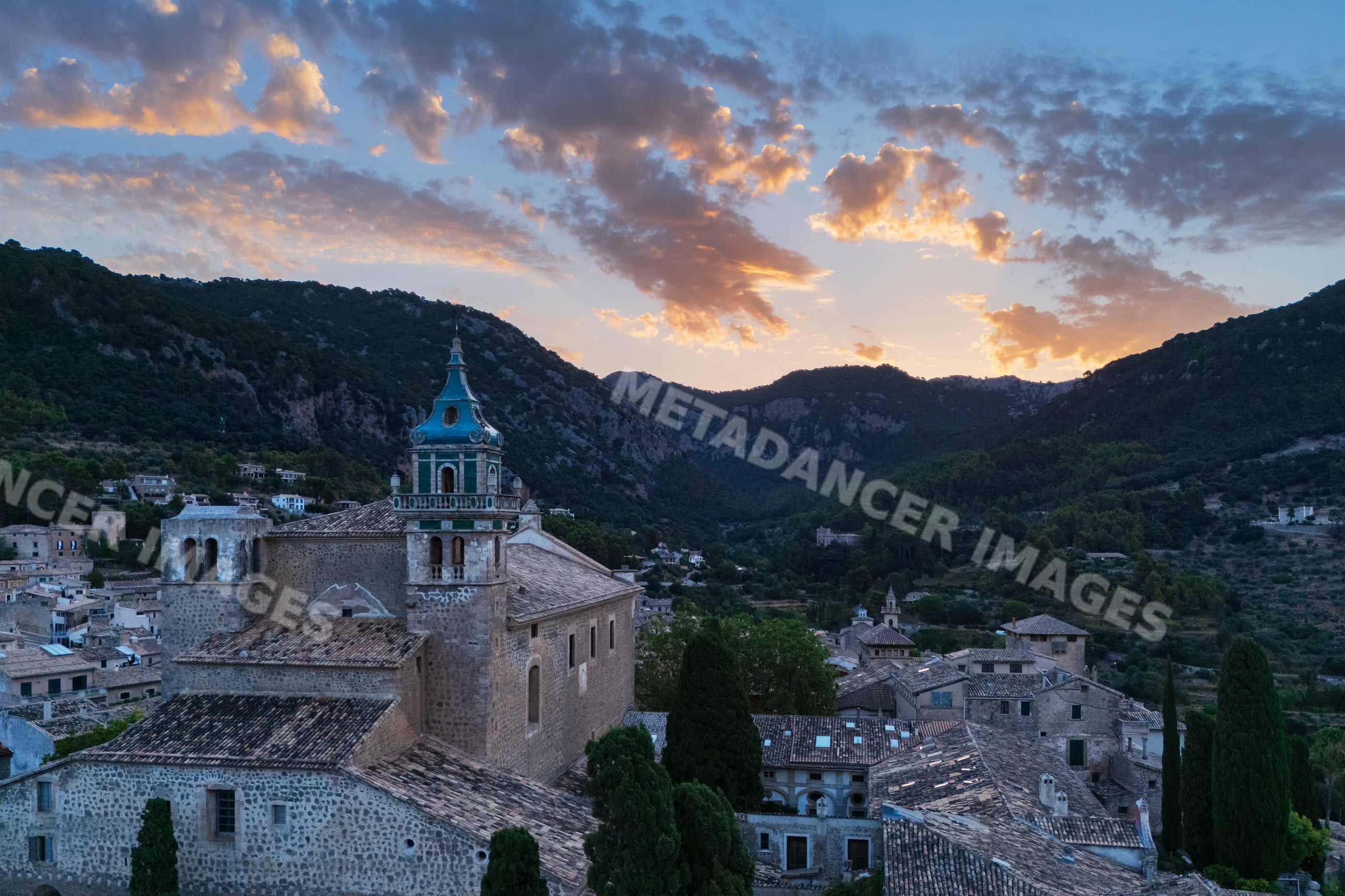 Valdemossa village Sunrise with church tower and mountain landscape