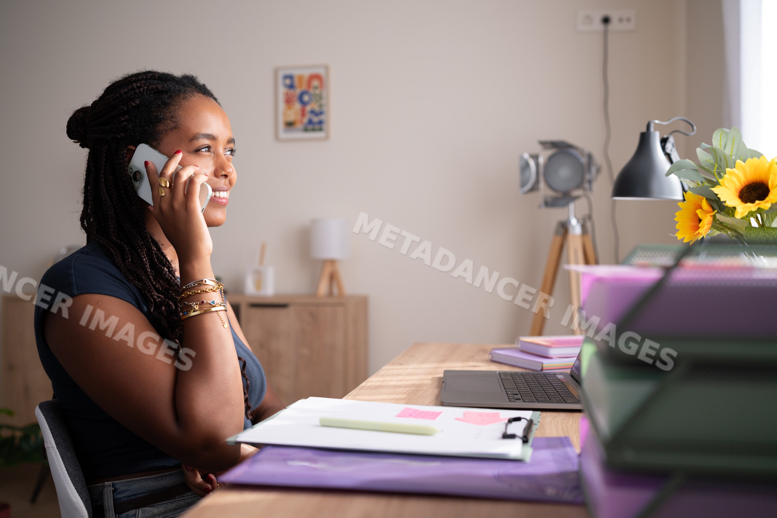 African American woman talks on the phone