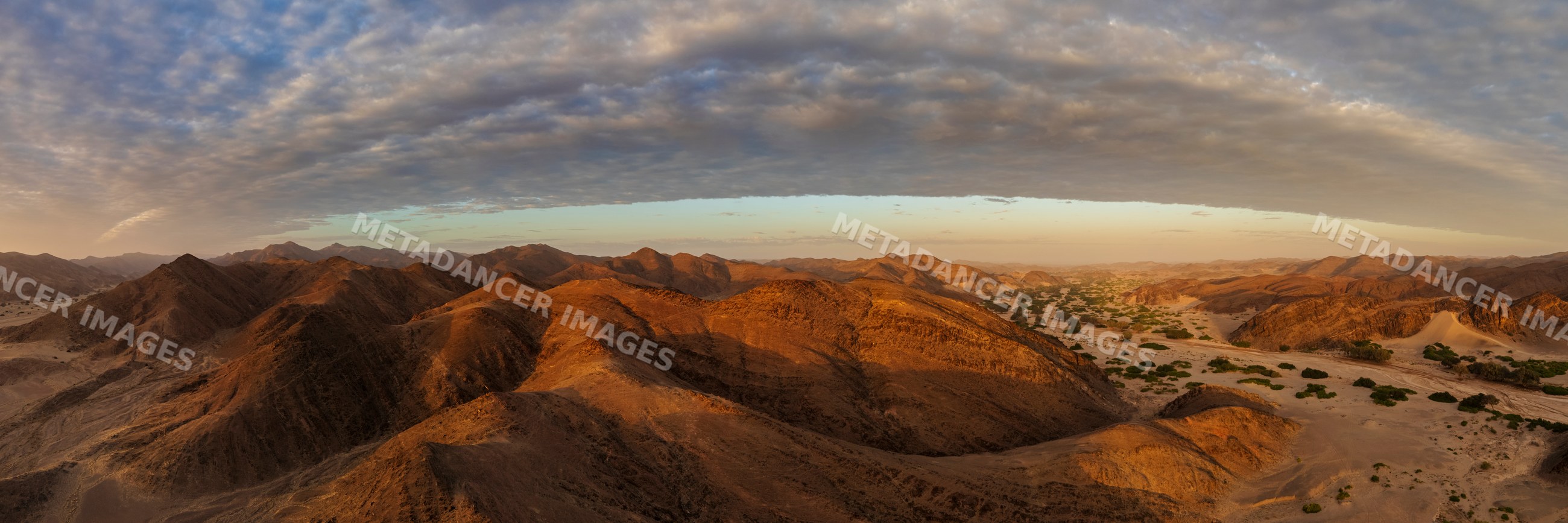 Sunrise over hoanib river valley desert mountains