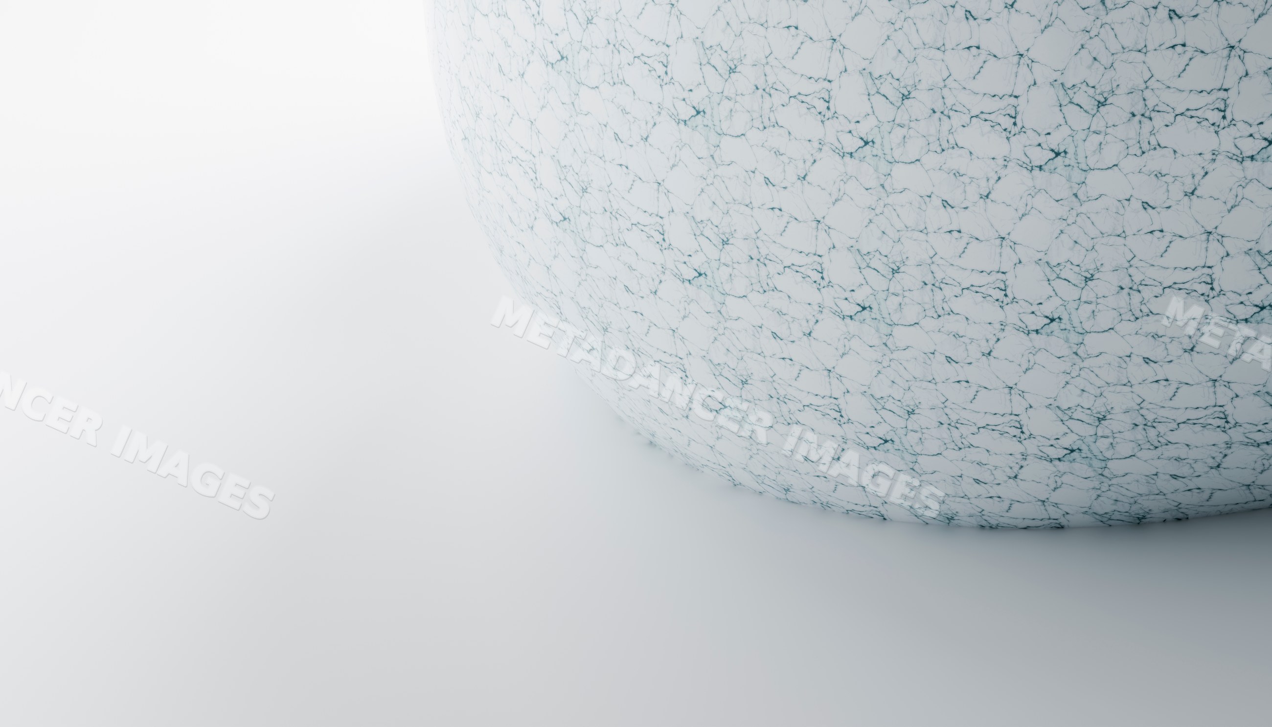 A white sphere with cracked texture on a smooth surface
