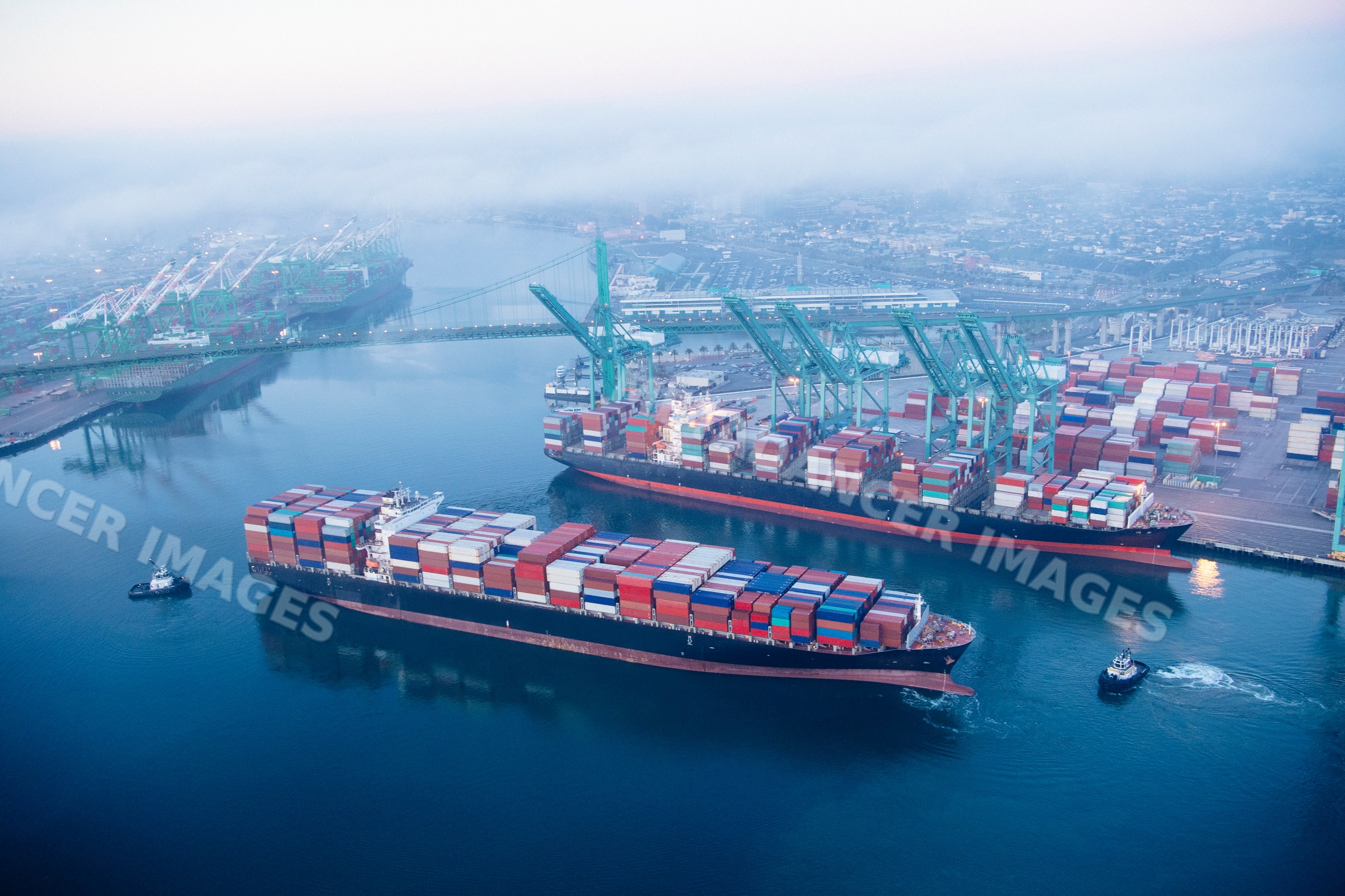 Aerial view of container ships at a busy port in a beach