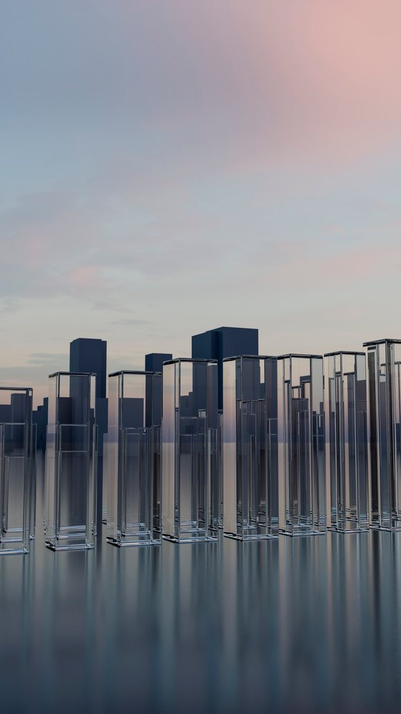 Glass skyscrapers reflecting evening sky in modern urban cityscape