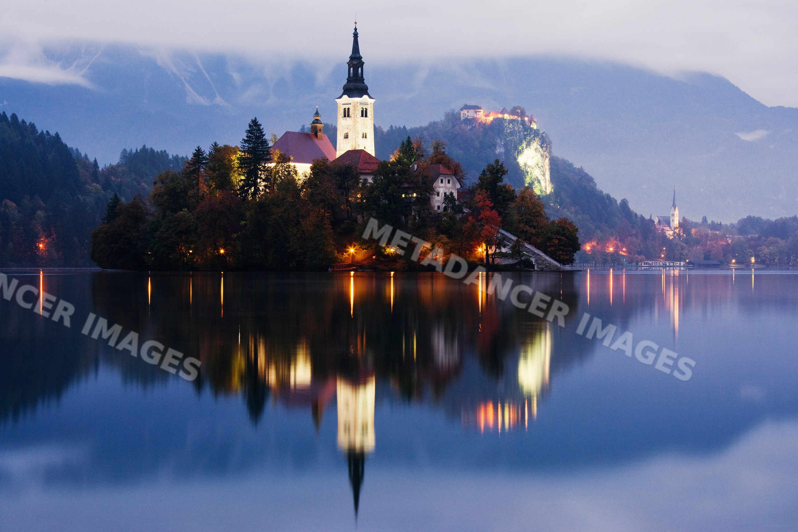 Church of assumption illuminated on island slovenia