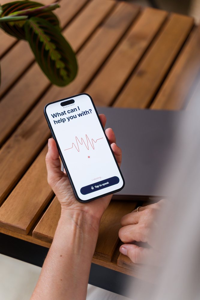 Smartphone showing voice assistant screen with voice command prompt