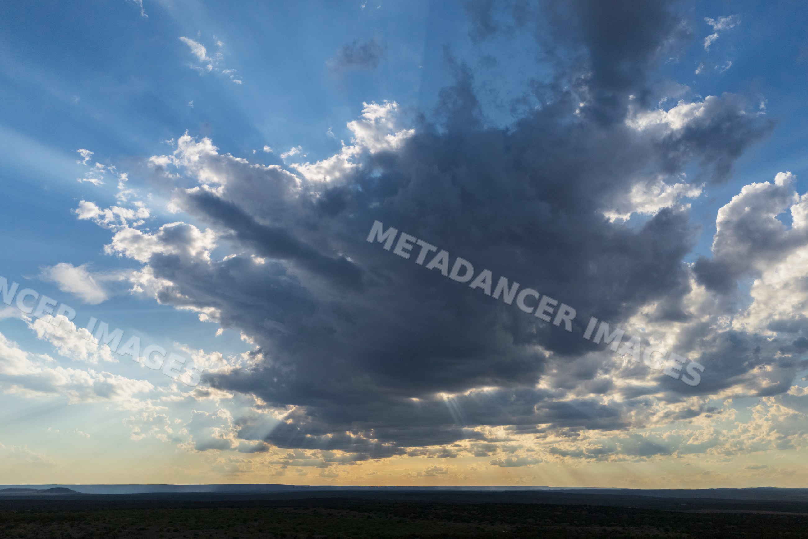 Crepuscular Rays piercing clouds over the Great Plains
