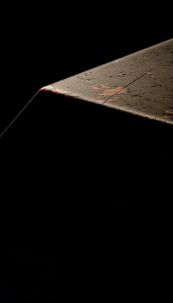 Close-up view of rusty metal corner with peeling paint and corrosion