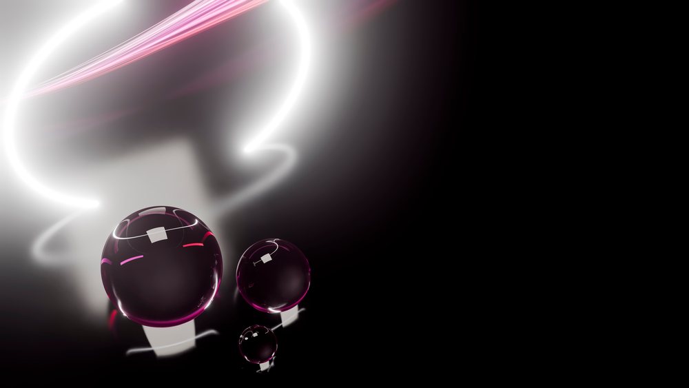 Reflective dark spherical orbs with glowing light trails