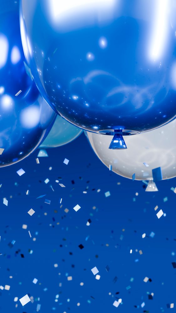 Blue and white balloons with colorful confetti celebrating
