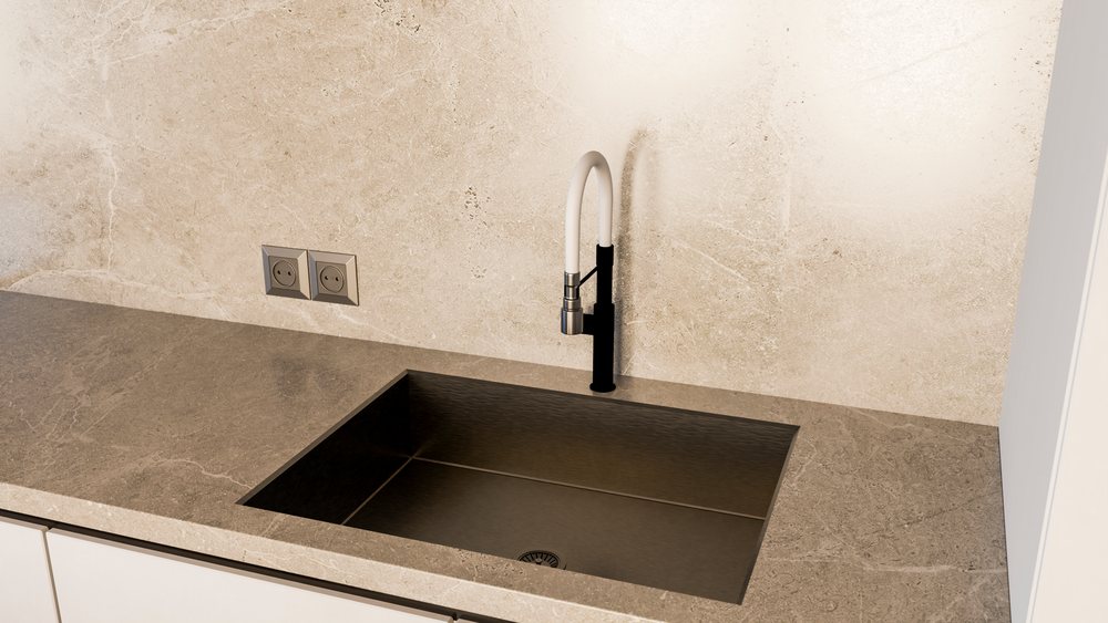 Modern kitchen sink with stainless steel basin and stone countertop