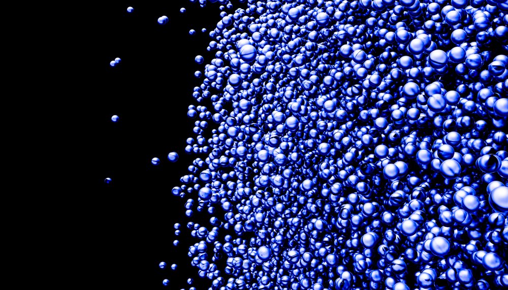 A cluster of blue bubbles floating against a black background