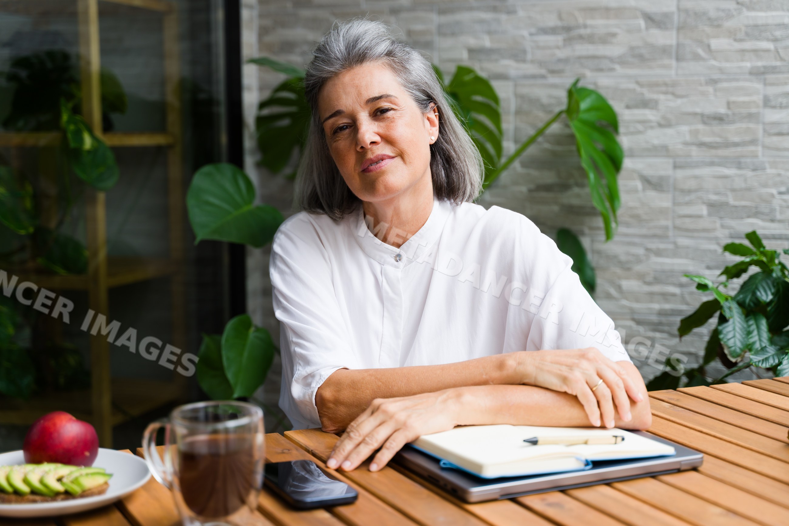 Middle-aged white woman sitting