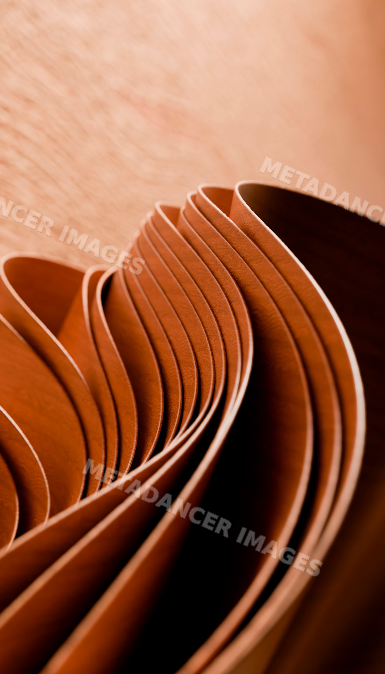 Rolled sheets of natural brown leather forming curved layers