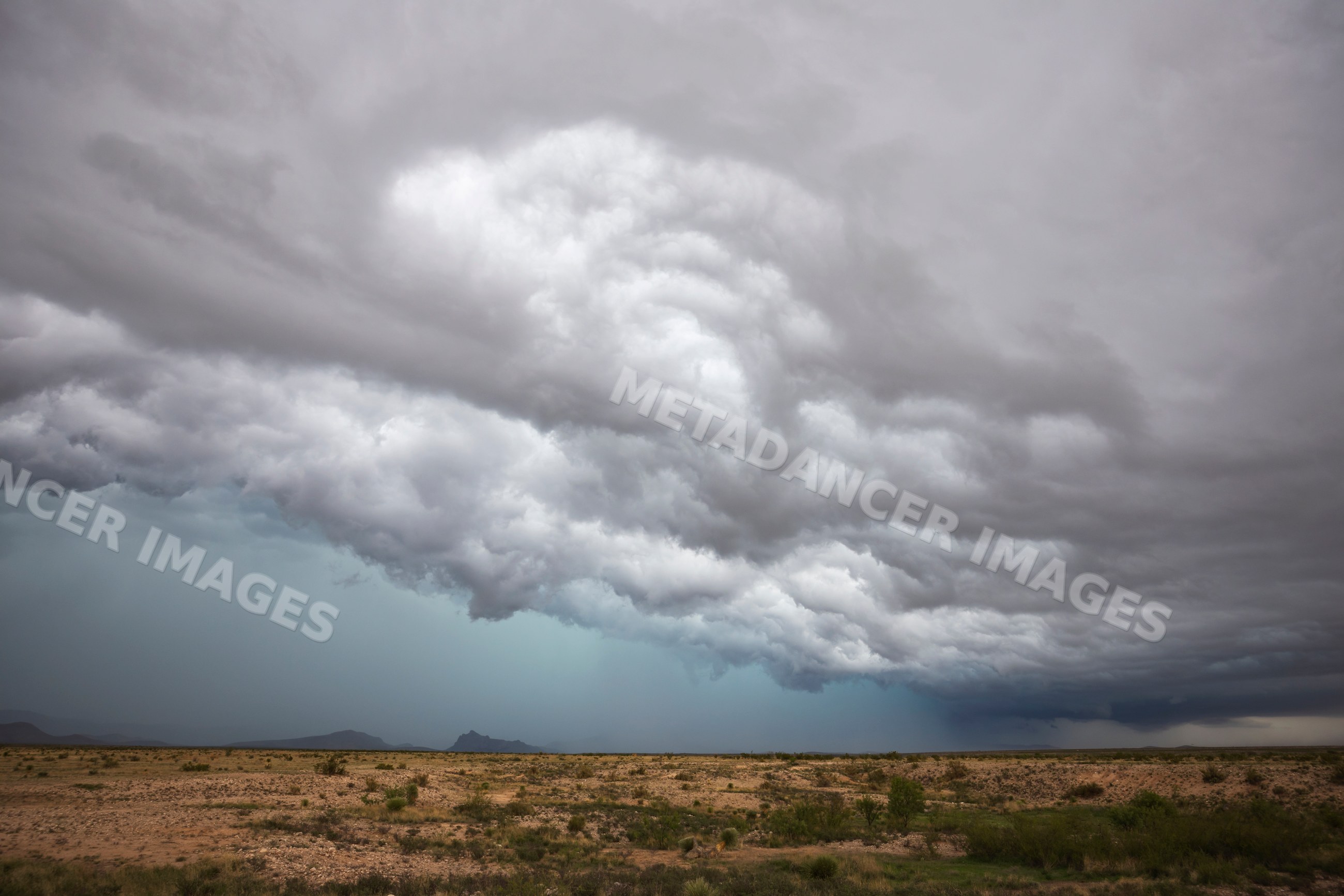 Supercell storm clouds over arid landscape in marathon, texas, USA