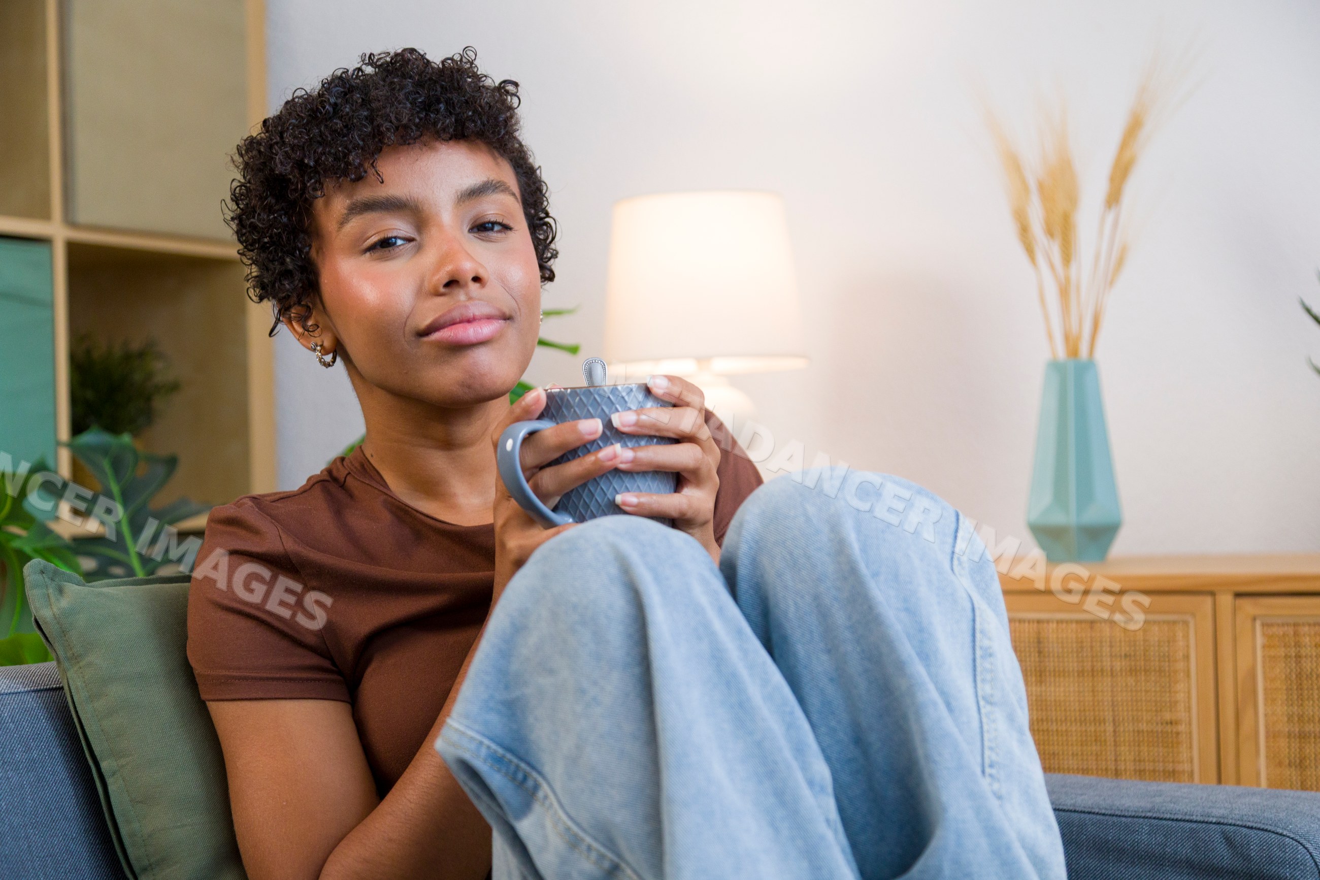 Young African American woman relaxing with a mug