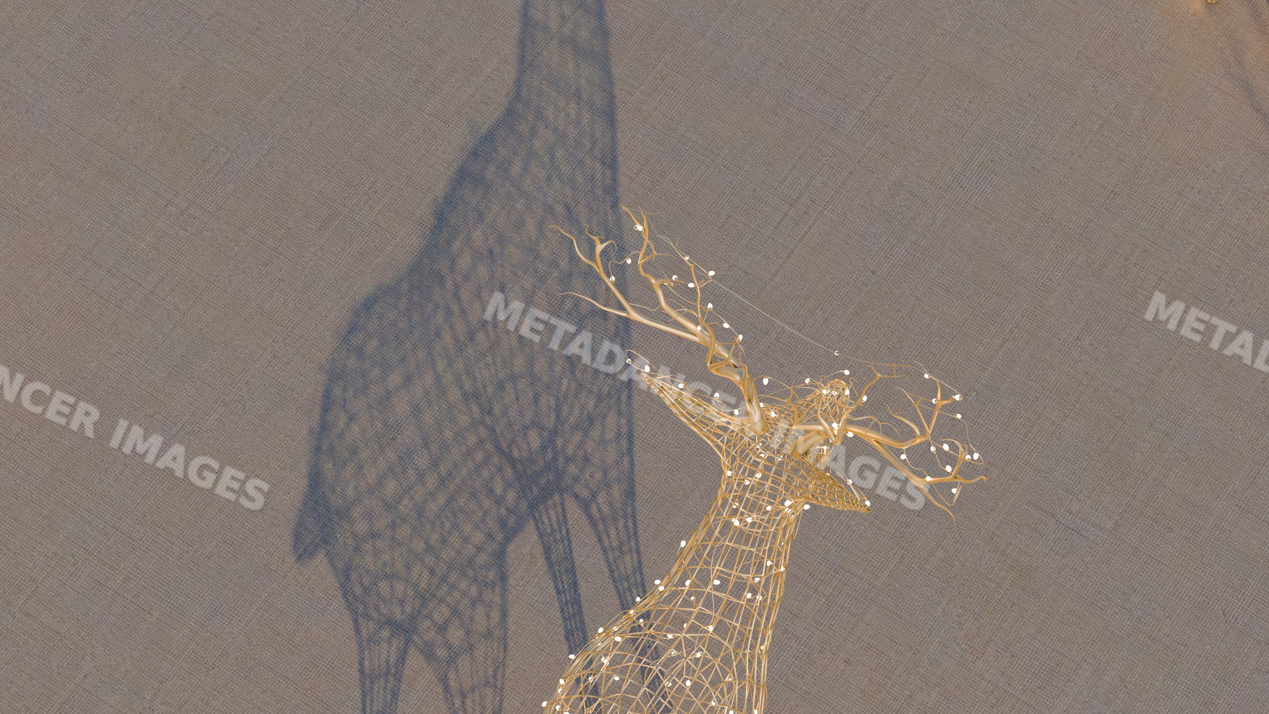 Wireframe deer sculpture with illuminated decorative branches indoors
