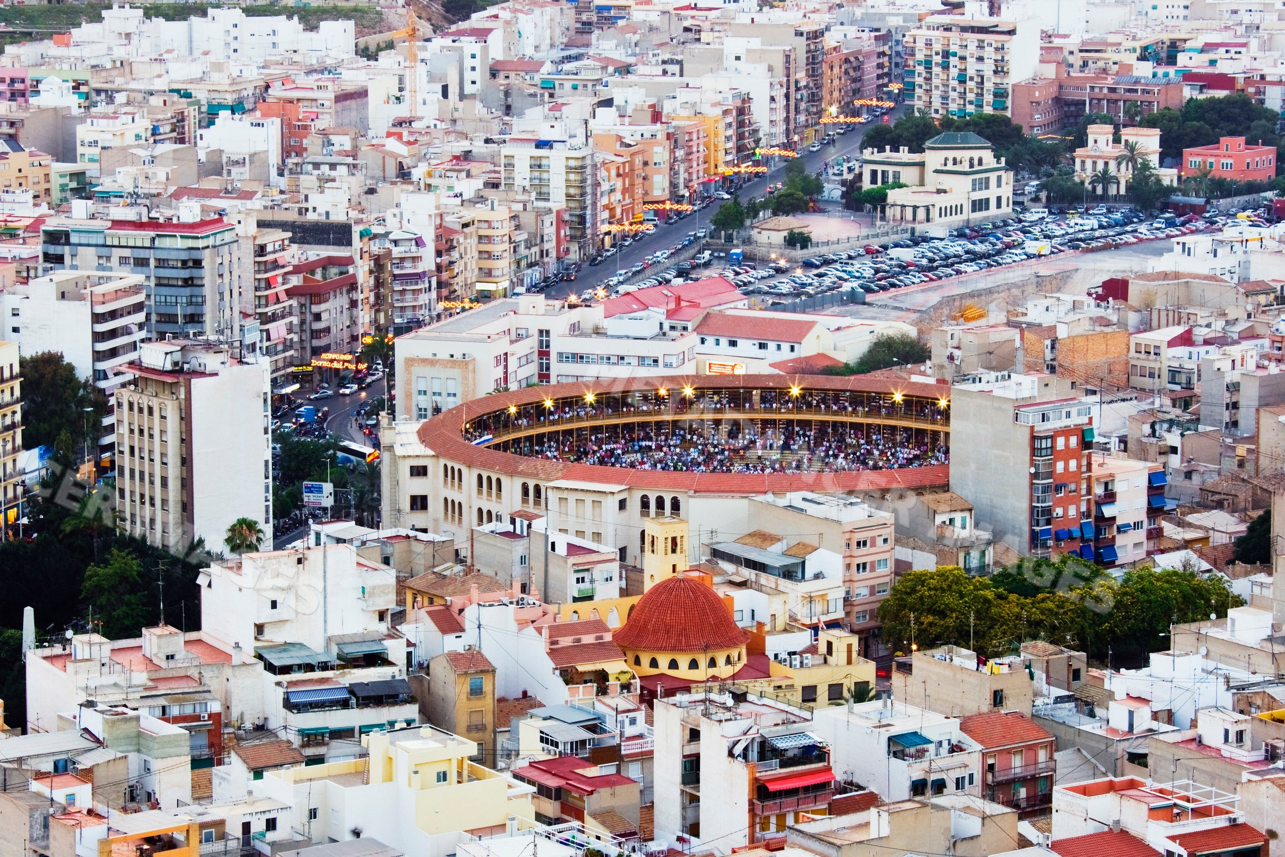 Bullring with crowd amidst urban buildings, costa blanca, Spain