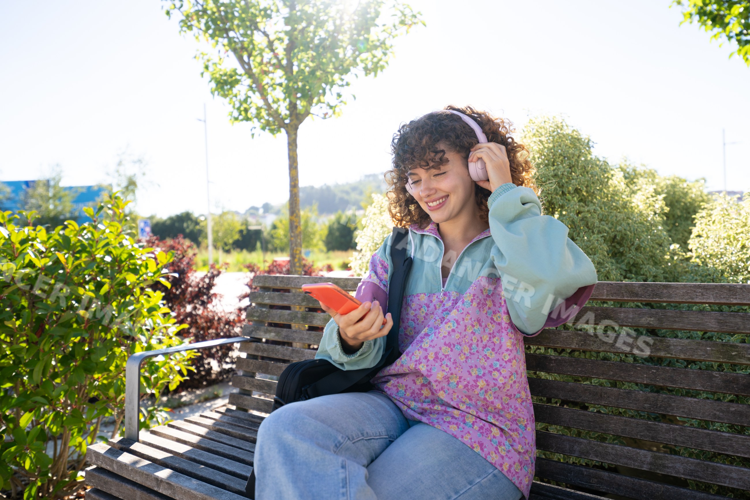 White woman enjoying music on headphones