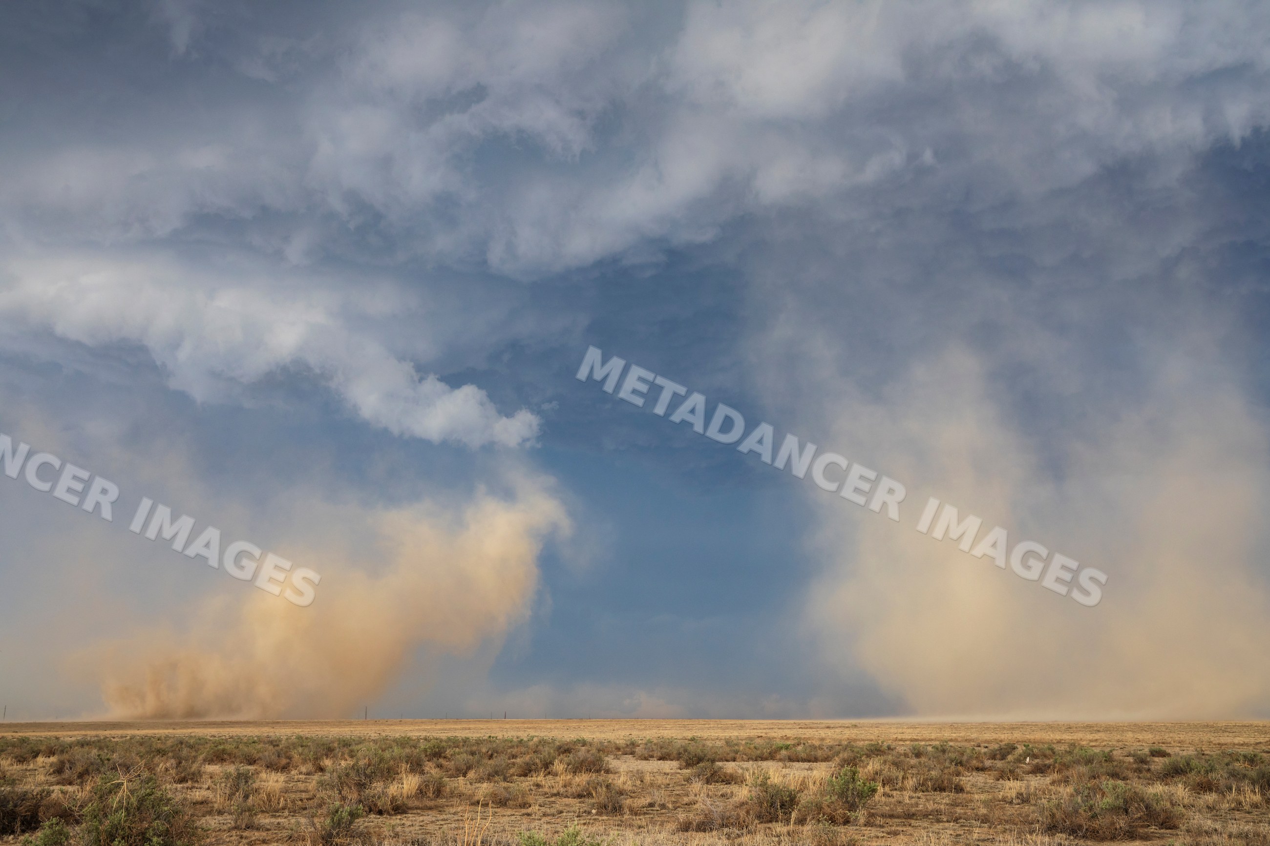 Dust storm caused by rotating updrafts from Tornado-Warned Supercell