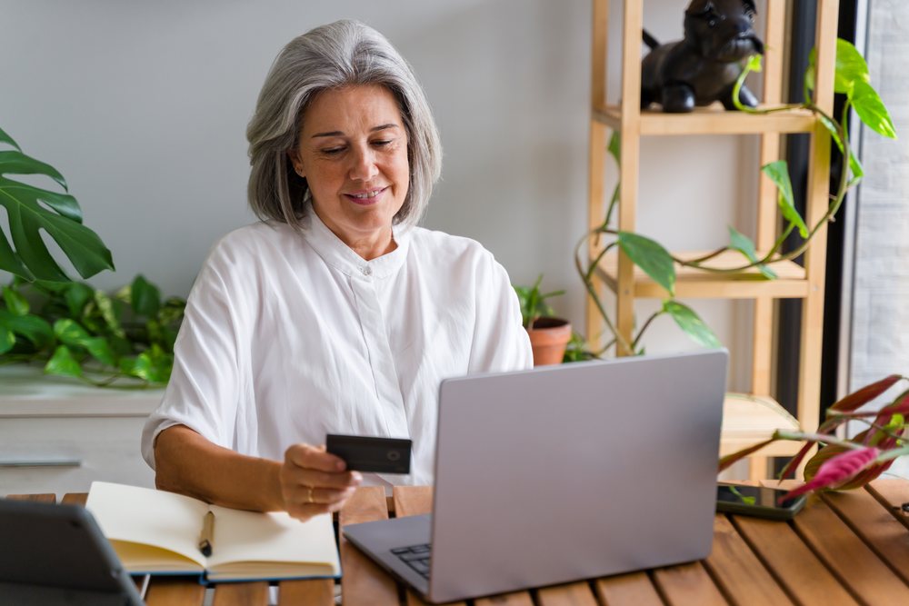 White Woman using credit card for online shopping