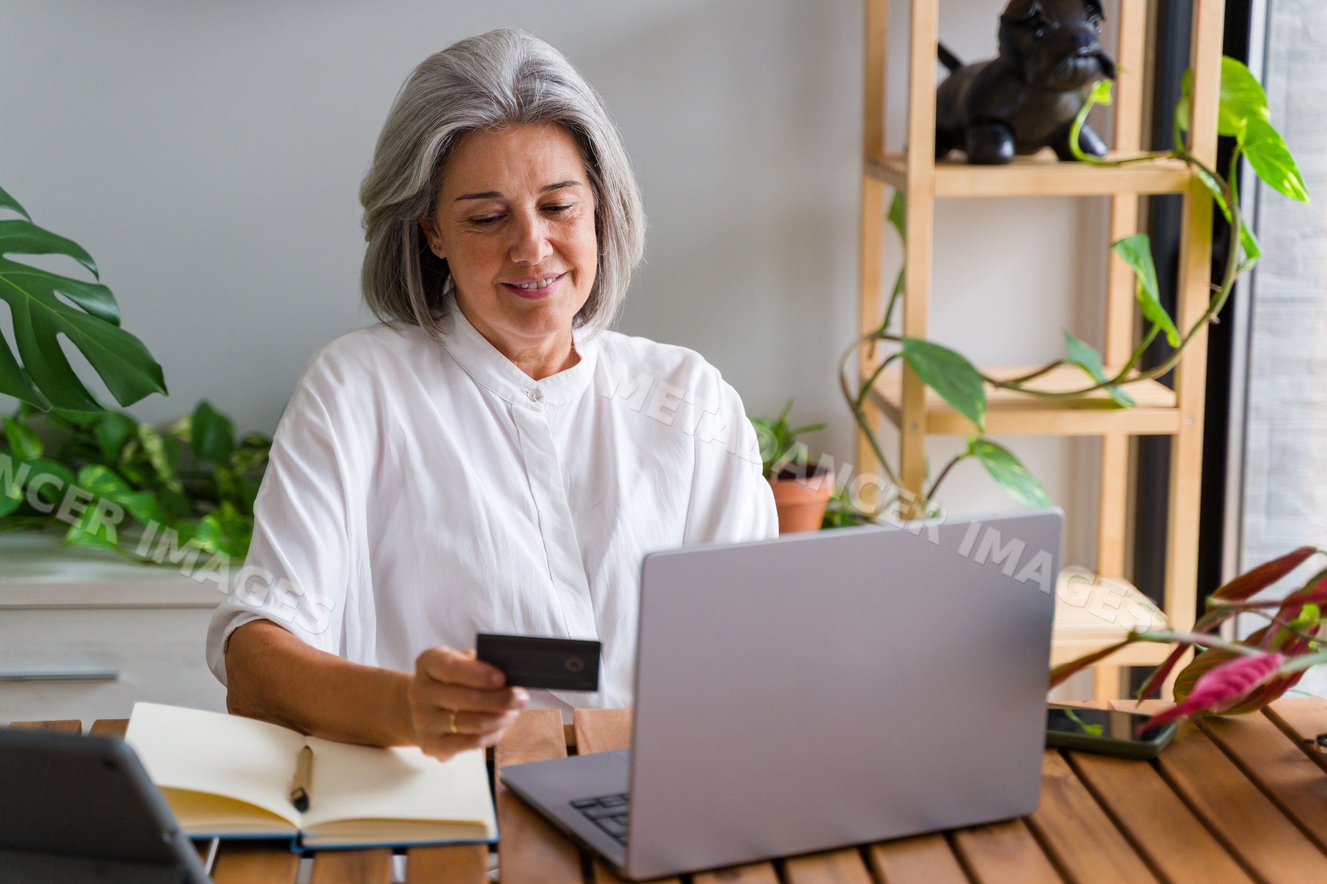 White Woman using credit card for online shopping