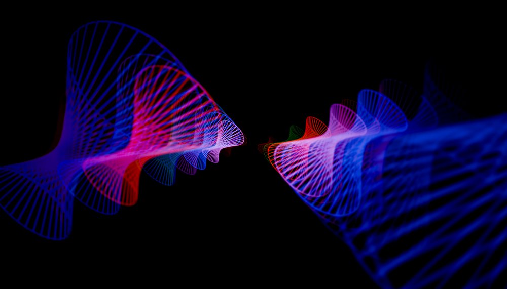Colorful abstract light trails form dynamic spiral patterns