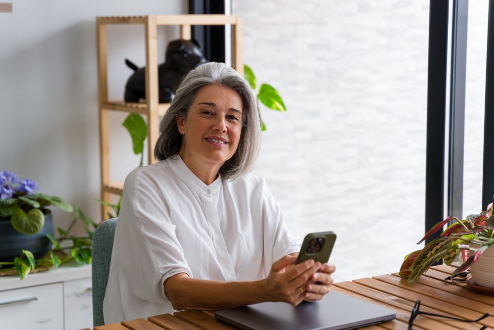 Middle aged white woman using smartphone