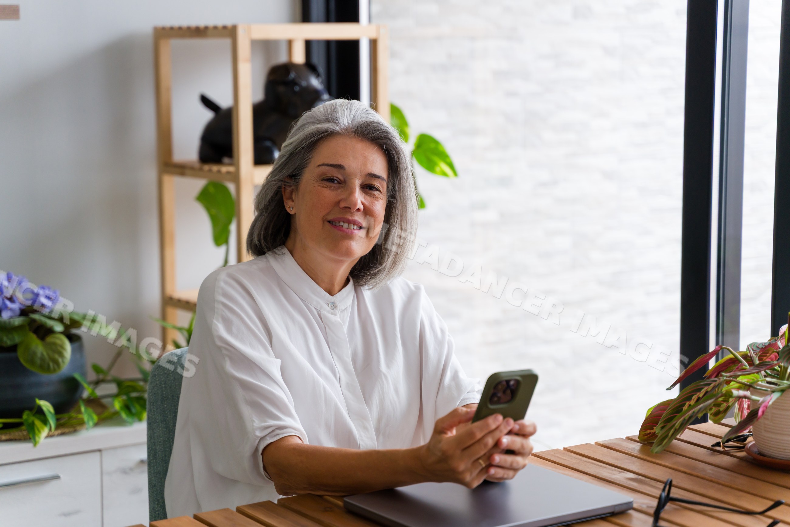 Middle aged white woman using smartphone