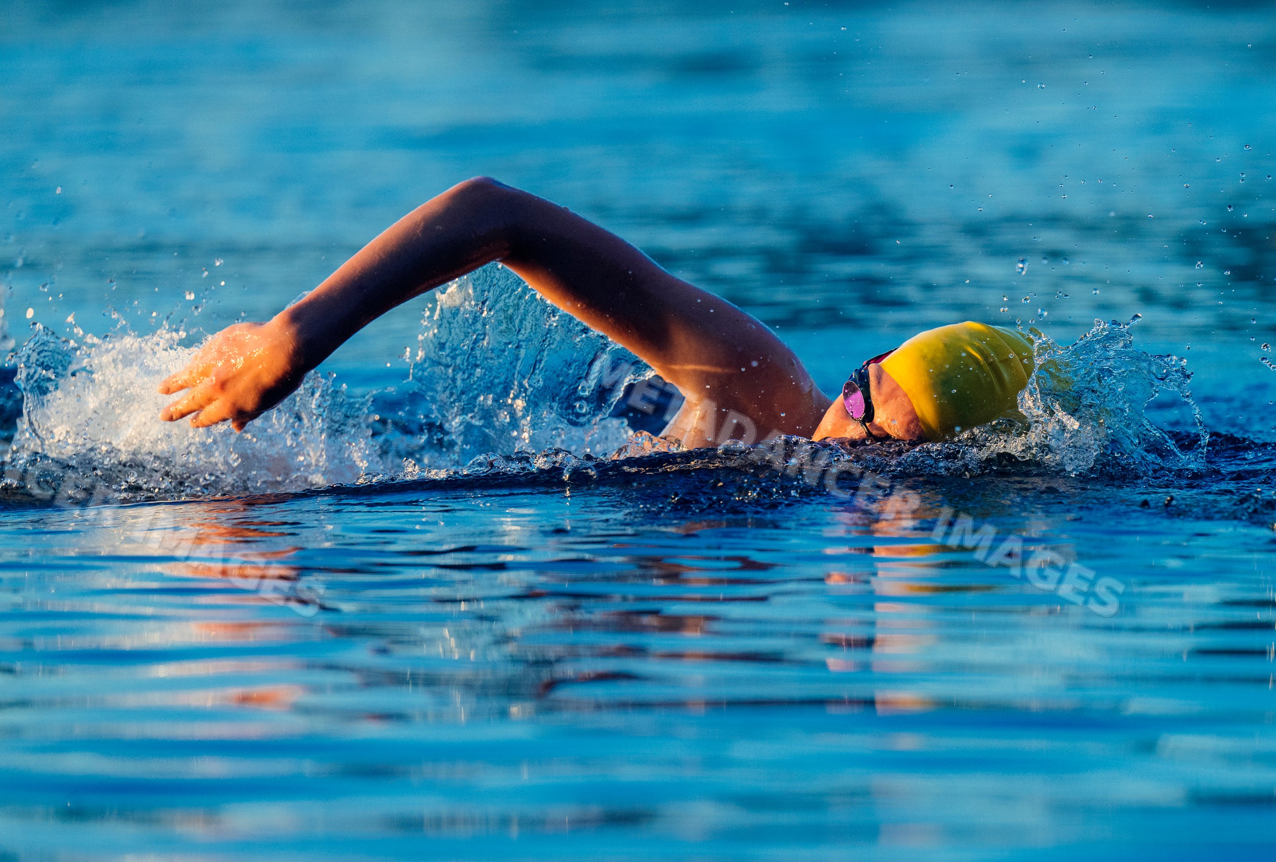 White swimmer performing freestyle stroke