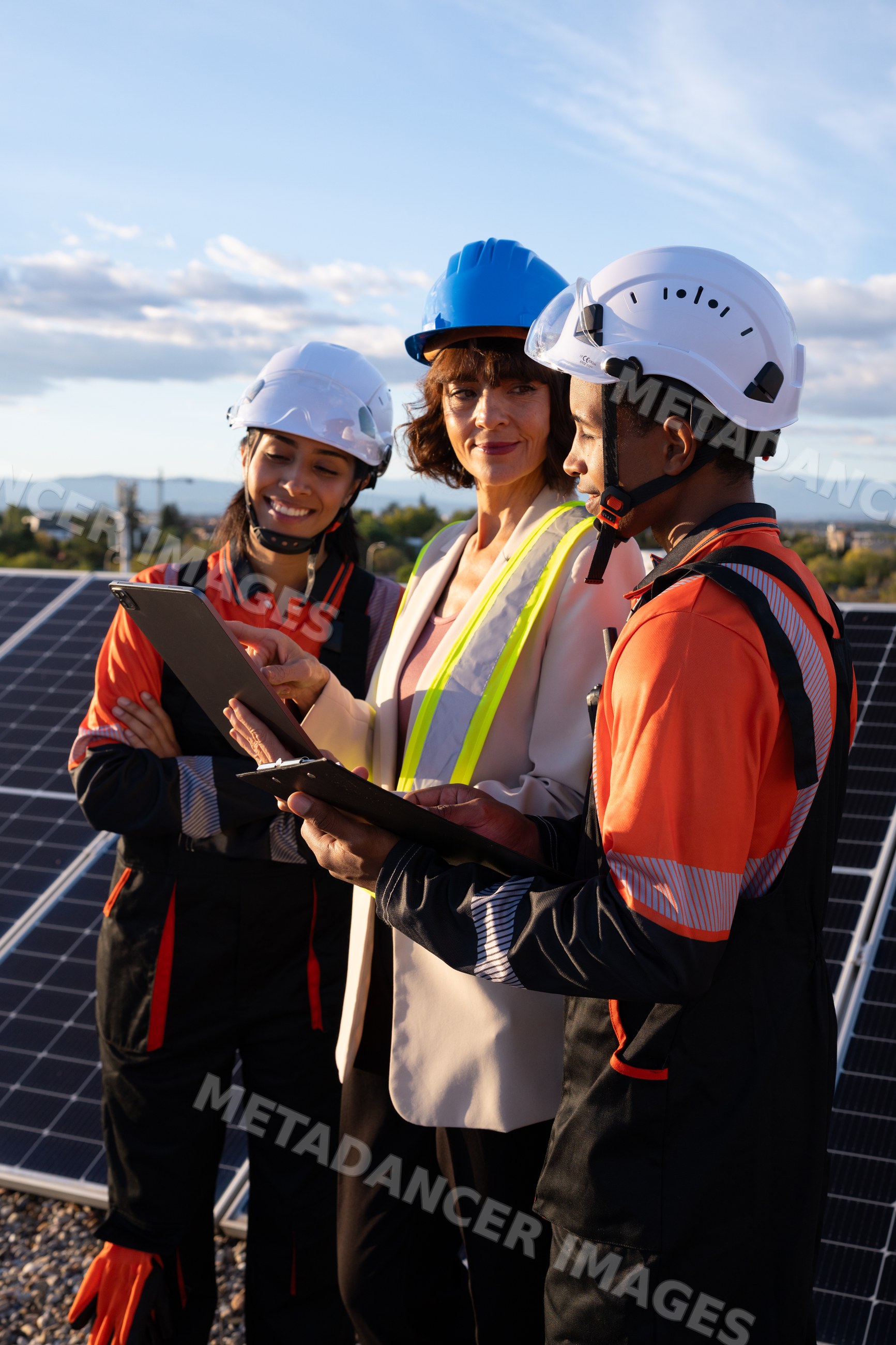 Engineers inspecting solar panels for solar energy in Madrid, Spain