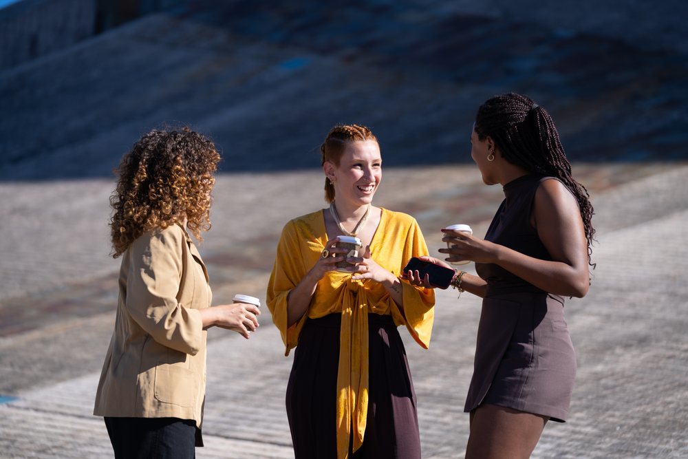 African American and white women enjoying coffee and conversation