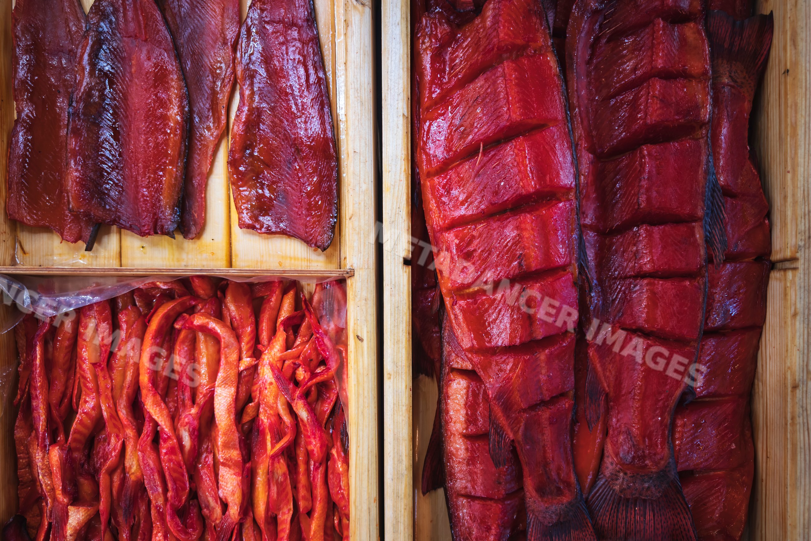 Smoked Fish salmon fillets and strips in wooden boxes in tsovagyugh