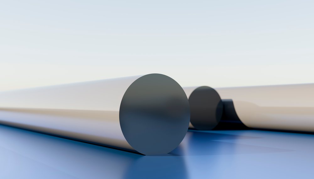 Metal rods arranged on a blue reflective industrial surface