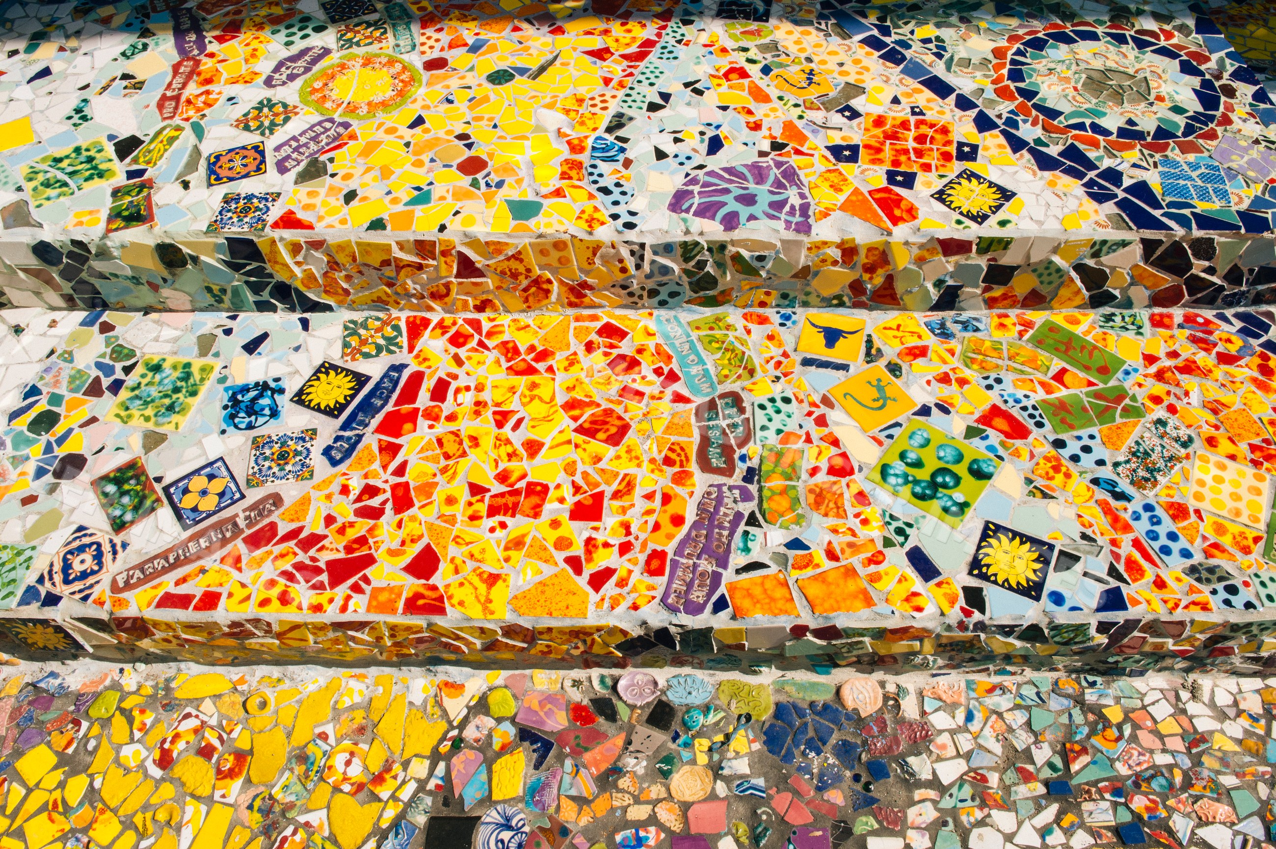 Colorful mosaic staircase decorated with vibrant ceramic tiles