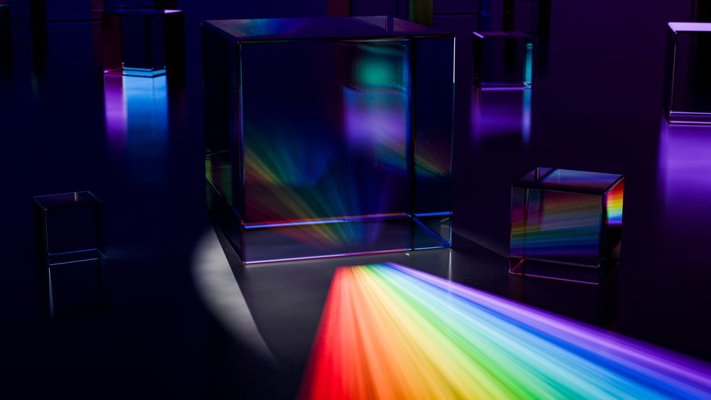 Glass prisms refracting vibrant rainbow light beams on dark surface