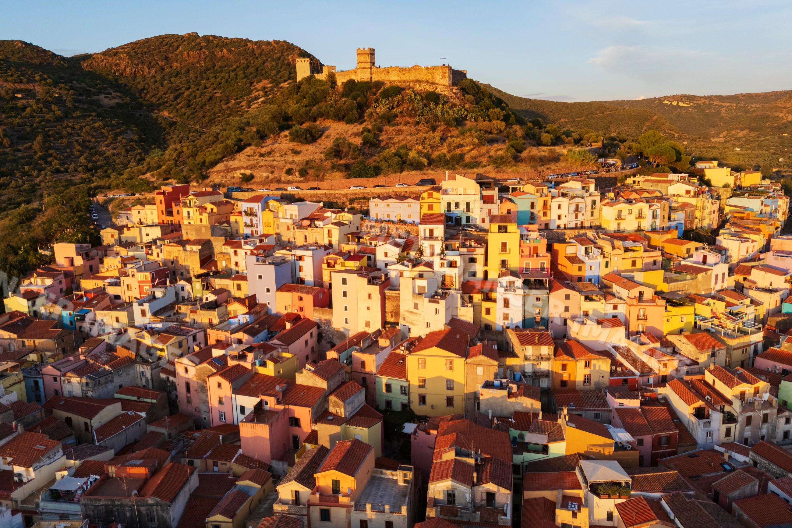 Old Town of bosa with hilltop castle at Sunset in Sardinia Italy