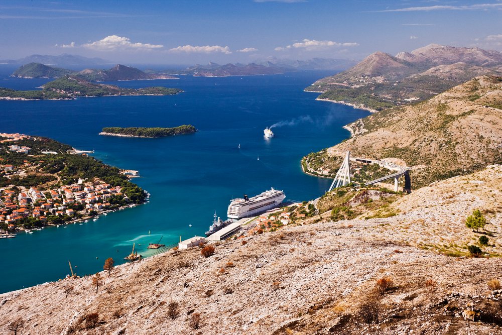 Harbor with cruise ships and coastal village near dubrovnik, croatia
