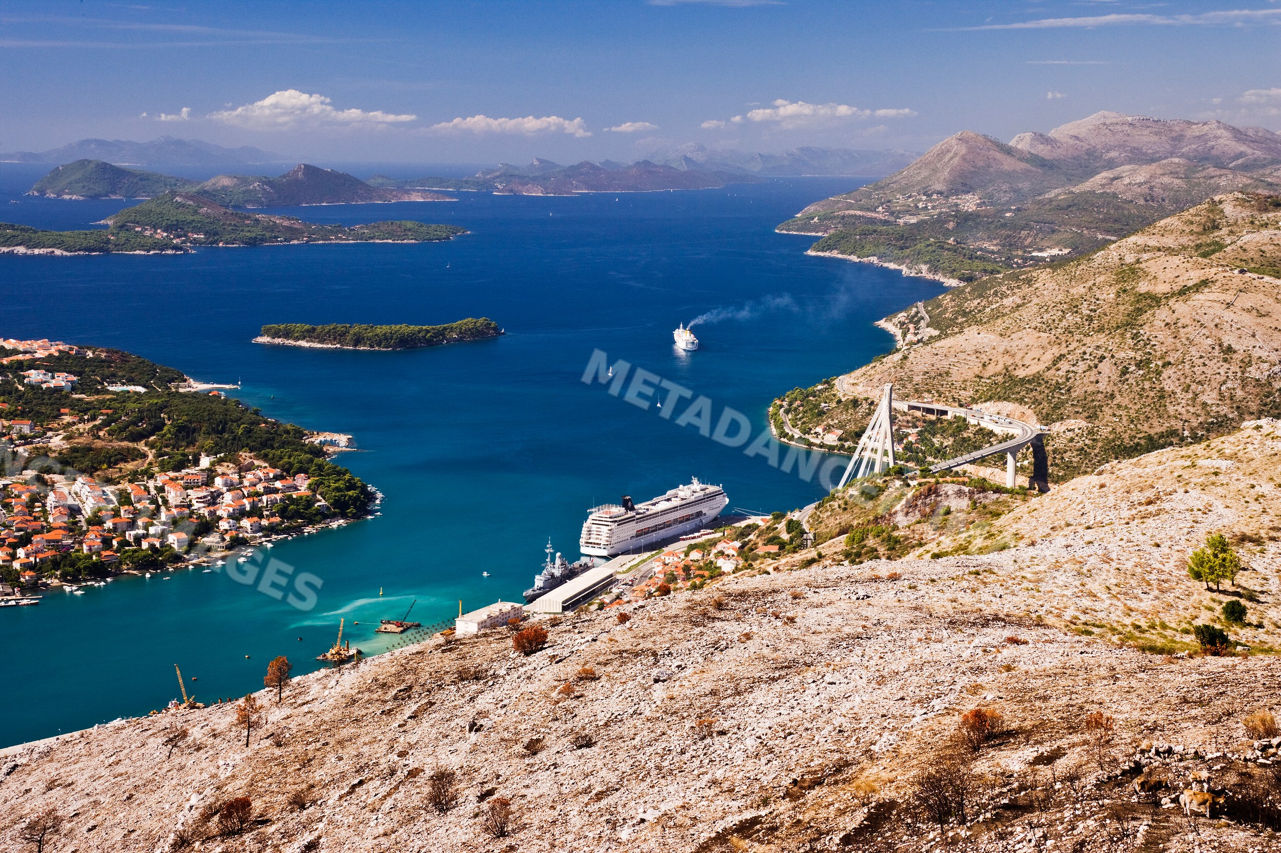 Harbor with cruise ships and coastal village near dubrovnik, croatia