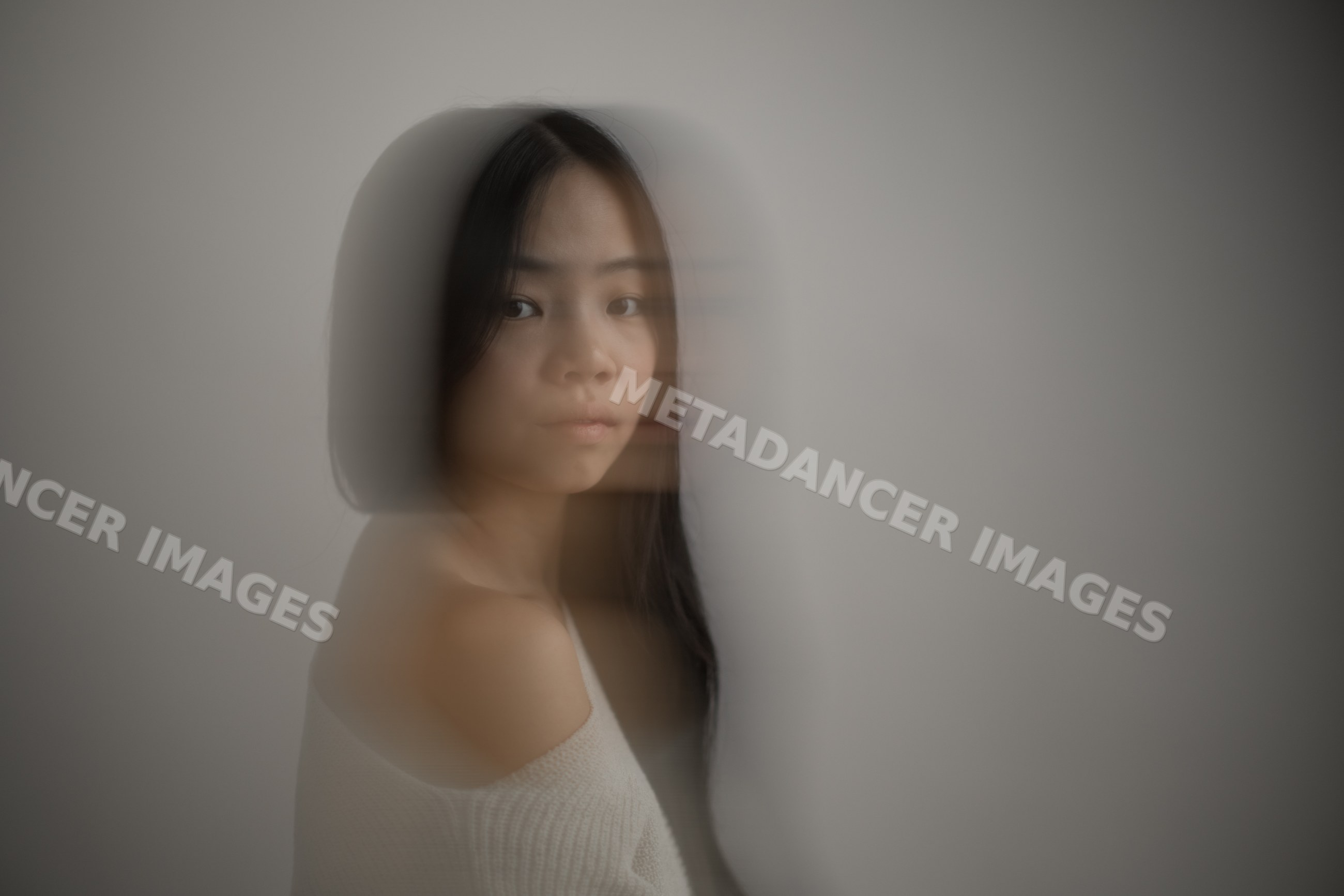 Portrait of young asian Southeast Asian woman with motion blur effect